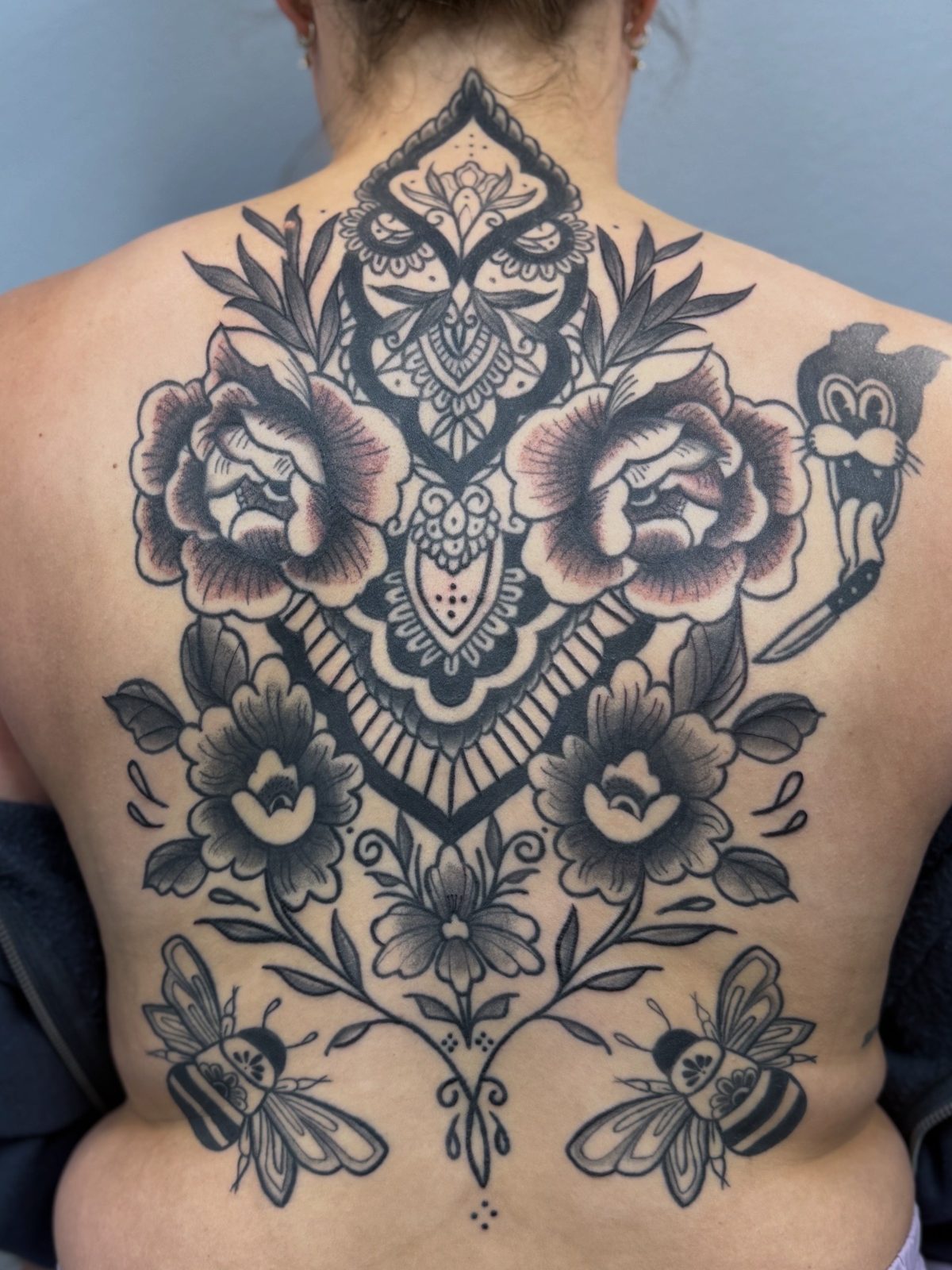Ornamental blackwork back tattoo